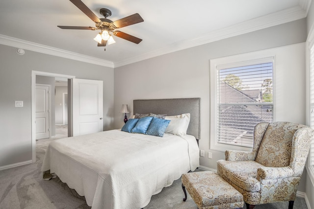 carpeted bedroom featuring ceiling fan, baseboards, and ornamental molding