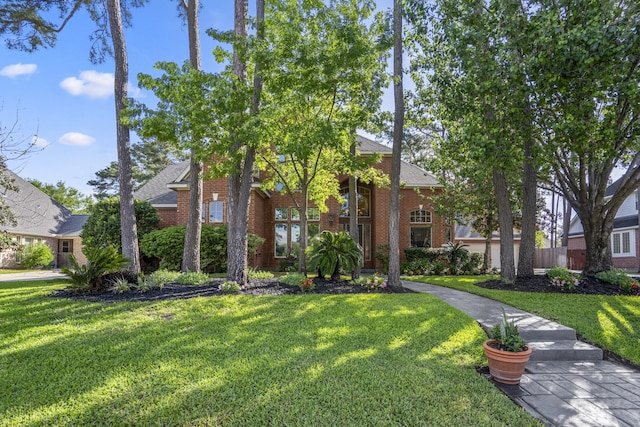 19402 Bremerton Ln, Spring, TX 77388 - view of front facade with a front lawn, brick siding, and a shingled roof