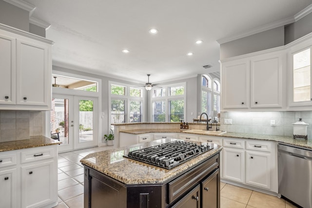 kitchen featuring a sink, light tile patterned floors, ceiling fan, appliances with stainless steel finishes, and recessed lighting