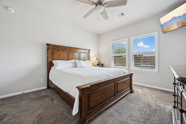carpeted bedroom with baseboards, visible vents, and ceiling fan