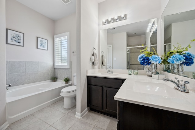 bathroom with a shower stall, tile patterned floors, a bath, and a sink