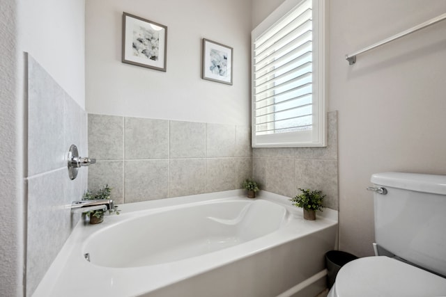full bath with a bath and toilet