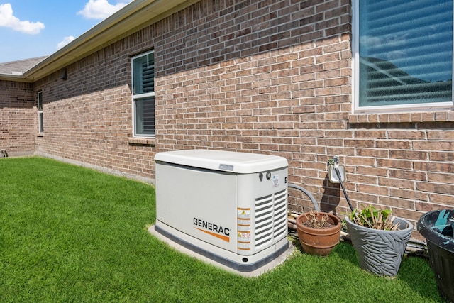 details featuring brick siding and a power unit