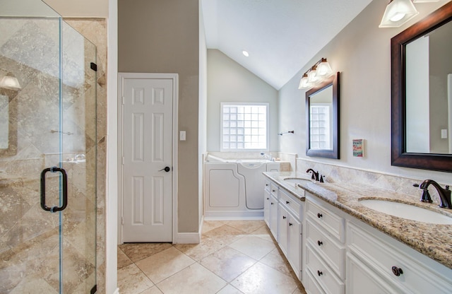 bathroom with a shower stall, a sink, and lofted ceiling