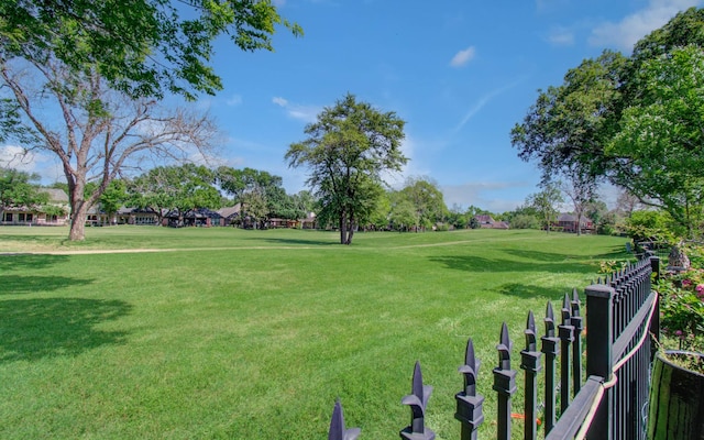 view of property's community with a lawn