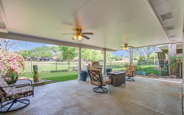 view of patio / terrace featuring a fire pit, visible vents, a fenced backyard, and a ceiling fan