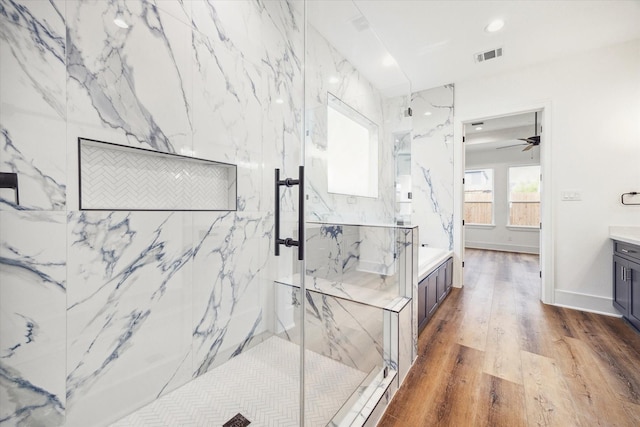 3314 Arbor, Houston, TX 77004 - bathroom featuring a marble finish shower, wood finished floors, vanity, ceiling fan, and recessed lighting