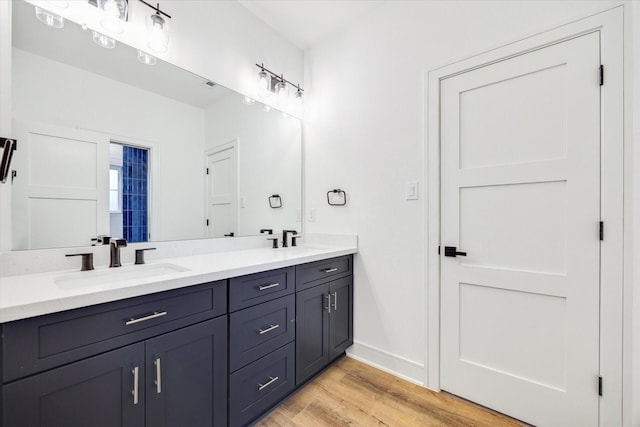 3314 Arbor, Houston, TX 77004 - bathroom with wood finished floors, double vanity, and baseboards