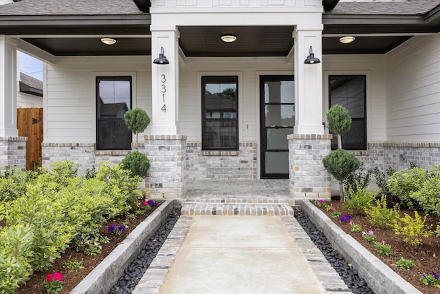 3314 Arbor, Houston, TX 77004 - property entrance featuring covered porch, roof with shingles, and brick siding