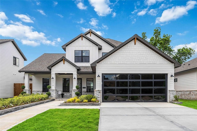 3314 Arbor, Houston, TX 77004 - view of front of home featuring a front yard, driveway, a shingled roof, covered porch, and an attached garage
