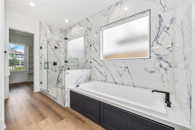 3314 Arbor, Houston, TX 77004 - full bathroom with a marble finish shower, a garden tub, recessed lighting, and wood finished floors