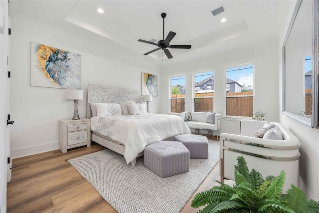 3314 Arbor, Houston, TX 77004 - bedroom featuring a tray ceiling, wood finished floors, recessed lighting, baseboards, and ceiling fan