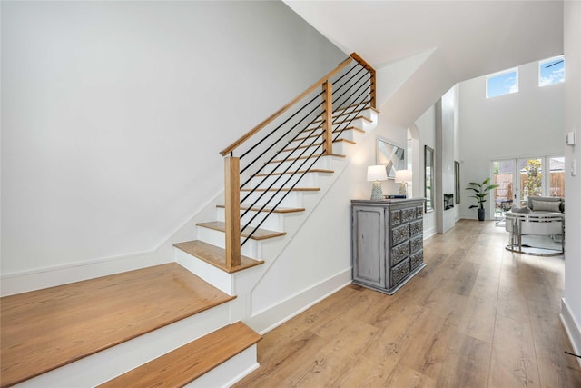 3314 Arbor, Houston, TX 77004 - staircase featuring wood finished floors, baseboards, and a high ceiling