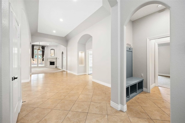 2423 Rosillos Peak Dr, Spring, TX 77386 - corridor with light tile patterned flooring, recessed lighting, and arched walkways