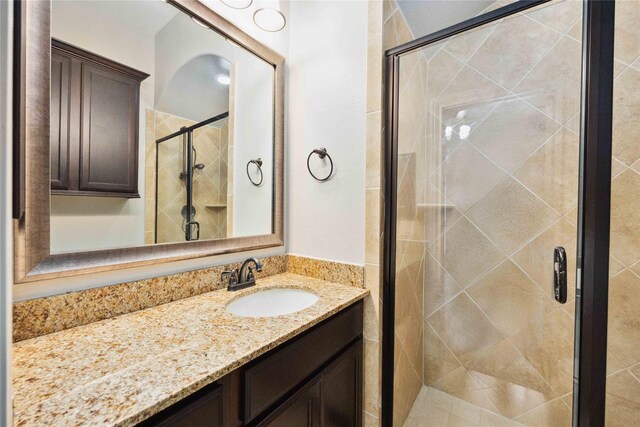 2423 Rosillos Peak Dr, Spring, TX 77386 - bathroom featuring vanity and a stall shower