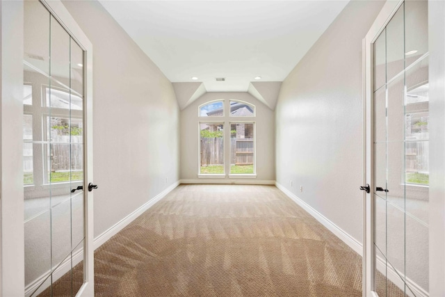 2423 Rosillos Peak Dr, Spring, TX 77386 - spare room with french doors, carpet floors, baseboards, plenty of natural light, and lofted ceiling