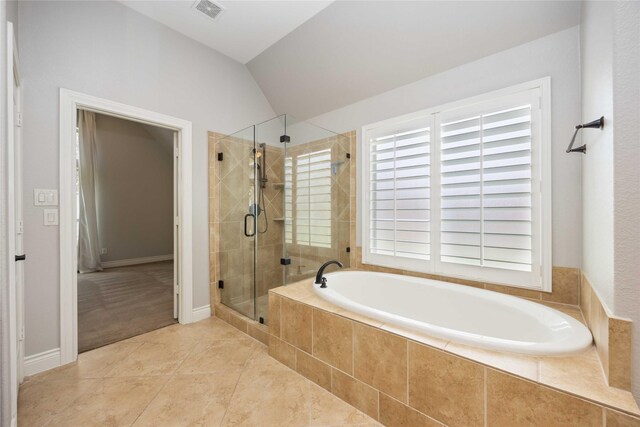 2423 Rosillos Peak Dr, Spring, TX 77386 - bathroom with vaulted ceiling, a stall shower, a bath, plenty of natural light, and tile patterned floors
