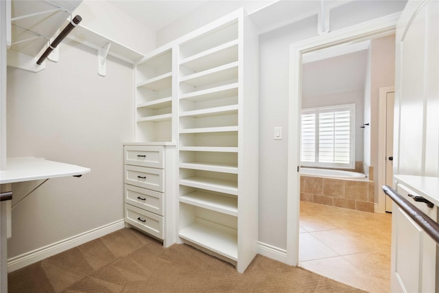 2423 Rosillos Peak Dr, Spring, TX 77386 - spacious closet featuring light tile patterned floors