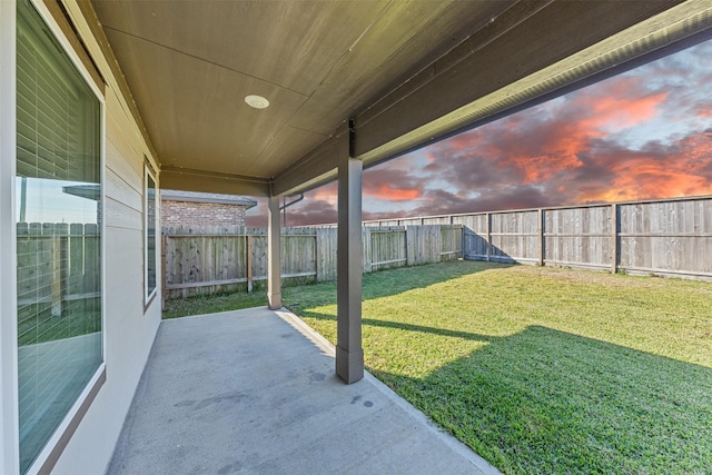 29607 Ella Larchmont Ct, Katy, TX 77494 - yard at dusk featuring a patio and a fenced backyard