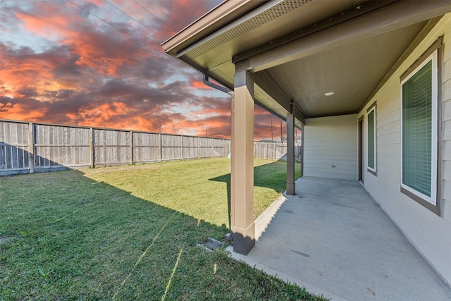29607 Ella Larchmont Ct, Katy, TX 77494 - yard at dusk featuring a fenced backyard and a patio