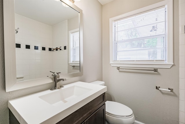 full bathroom with vanity and toilet