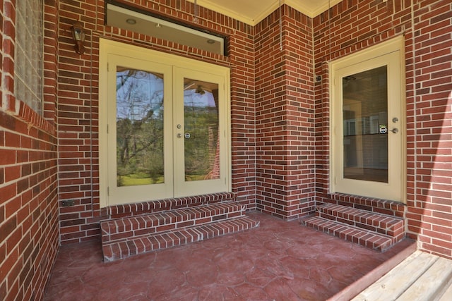 entrance to property with french doors and brick siding
