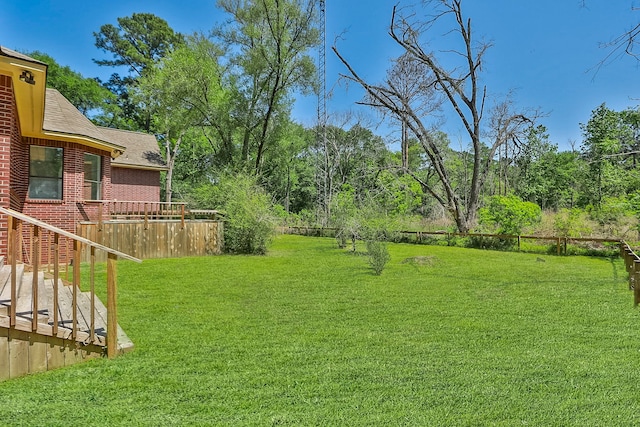 view of yard with a wooden deck