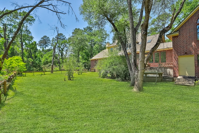 view of yard featuring a wooden deck
