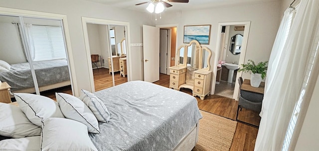 3703 Peppermill Rd, Houston, TX 77080 - bedroom featuring wood finished floors, a ceiling fan, two closets, and ensuite bathroom