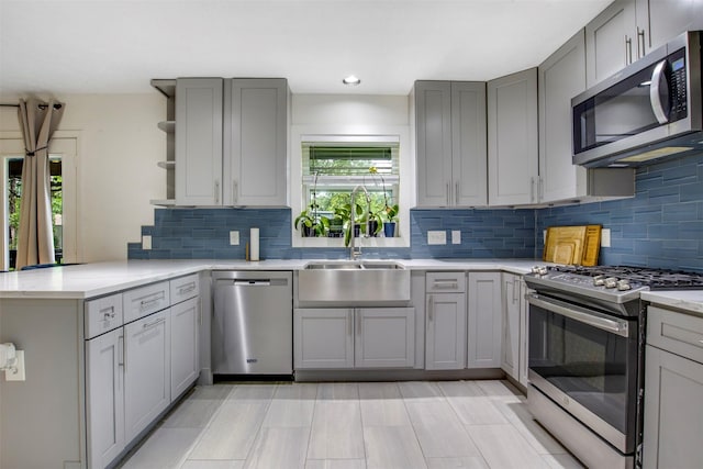 3703 Peppermill Rd, Houston, TX 77080 - kitchen with stainless steel appliances, gray cabinets, a sink, open shelves, and recessed lighting