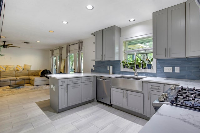 3703 Peppermill Rd, Houston, TX 77080 - kitchen featuring stainless steel dishwasher, gray cabinetry, backsplash, a peninsula, and open floor plan
