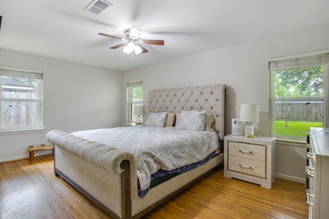 3703 Peppermill Rd, Houston, TX 77080 - bedroom with baseboards, multiple windows, light wood-type flooring, and ceiling fan