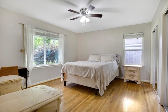 3703 Peppermill Rd, Houston, TX 77080 - bedroom with multiple windows, light wood finished floors, baseboards, and a ceiling fan