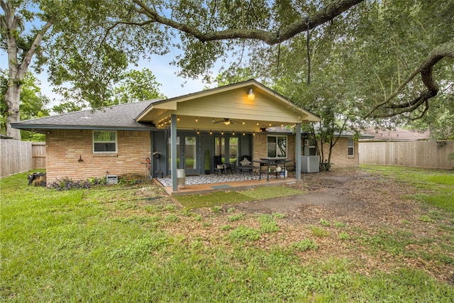 3703 Peppermill Rd, Houston, TX 77080 - rear view of house with ceiling fan, brick siding, and a patio area