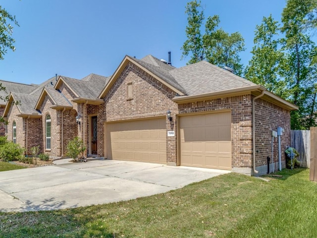 single story home featuring roof with shingles, driveway, a front lawn, brick siding, and a garage
