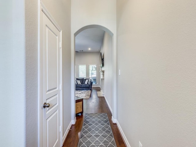 2054 Brookmont Dr, Conroe, TX 77301 - corridor with arched walkways, dark wood-style flooring, and baseboards