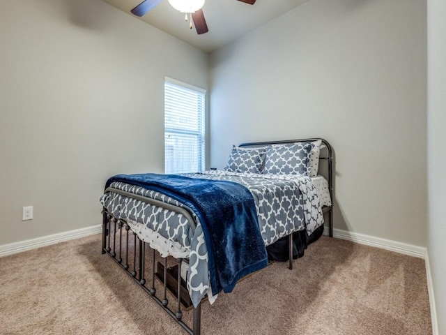 bedroom featuring carpet flooring, baseboards, and ceiling fan