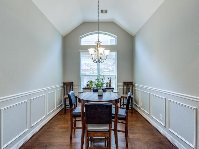 dining space with a decorative wall, an inviting chandelier, dark wood-style floors, and visible vents