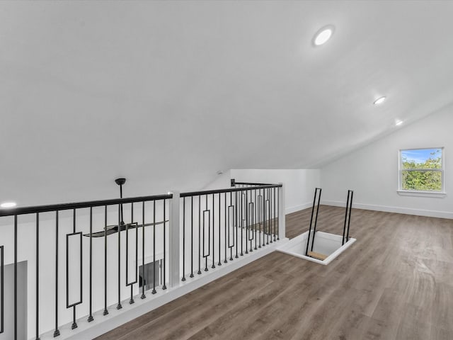 bonus room with wood finished floors, baseboards, vaulted ceiling, and recessed lighting