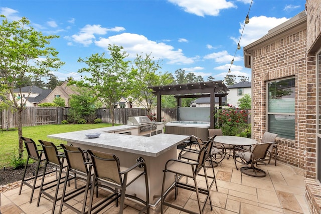 404 Christians Ct, Montgomery, TX 77316 - view of patio featuring a fenced backyard, a grill, outdoor wet bar, and area for grilling