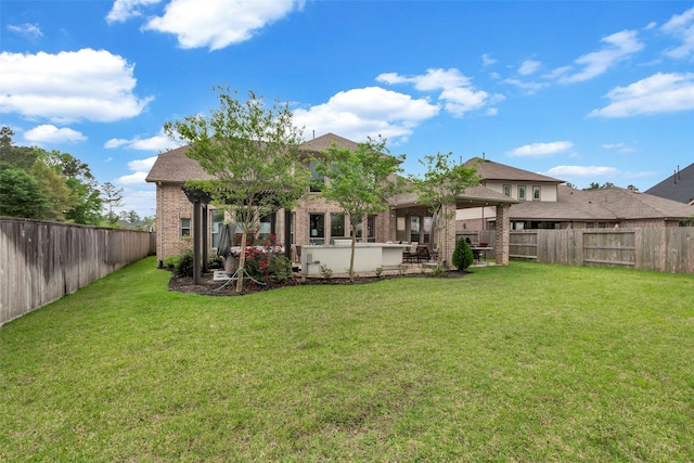404 Christians Ct, Montgomery, TX 77316 - back of property featuring brick siding, a gazebo, a fenced backyard, and a lawn