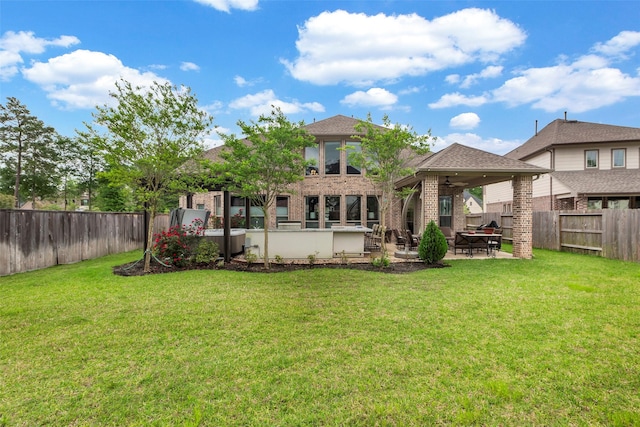 404 Christians Ct, Montgomery, TX 77316 - rear view of property featuring a fenced backyard, brick siding, a ceiling fan, and a yard