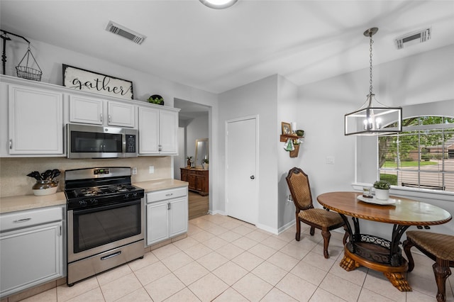 kitchen with visible vents, light countertops, and appliances with stainless steel finishes
