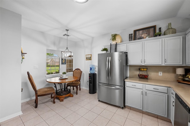 kitchen featuring visible vents, light countertops, appliances with stainless steel finishes, pendant lighting, and light tile patterned flooring