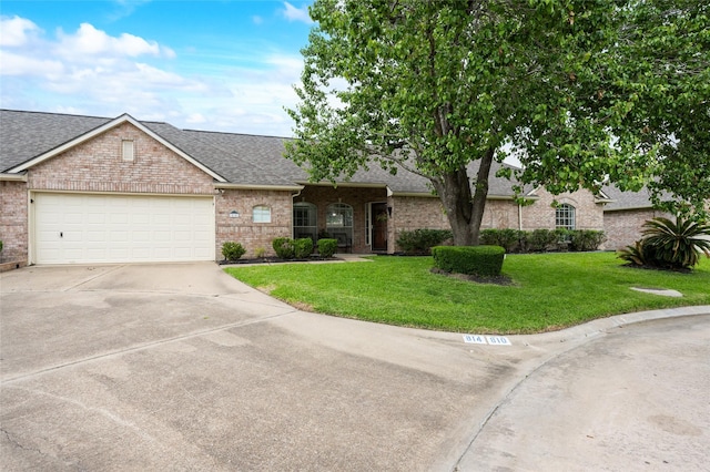 ranch-style home with roof with shingles, driveway, a front yard, and brick siding