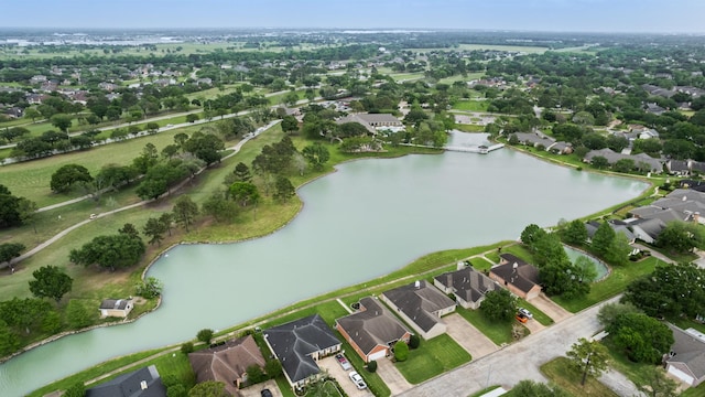 drone / aerial view with a water view and a residential view