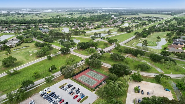 birds eye view of property featuring golf course view, a residential view, and a water view