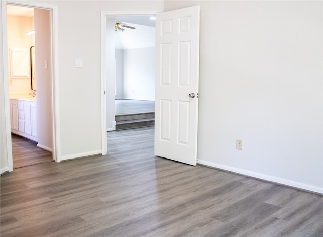 3222 Serene Oak Dr, Sugar Land, TX 77478 - unfurnished bedroom with wood finished floors and baseboards