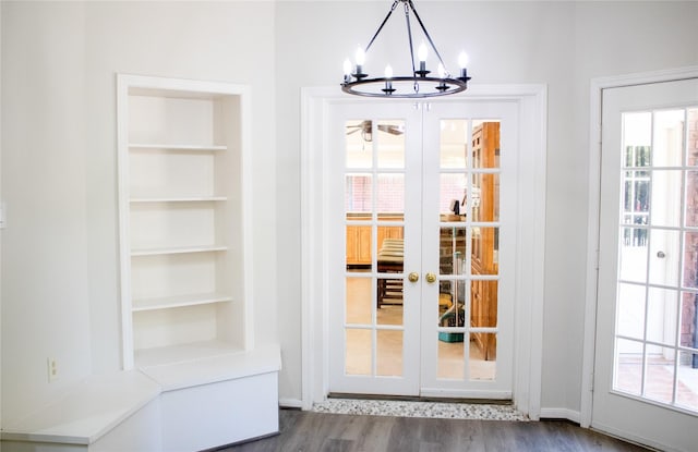 3222 Serene Oak Dr, Sugar Land, TX 77478 - doorway to outside featuring french doors, a chandelier, dark wood-style flooring, and built in features