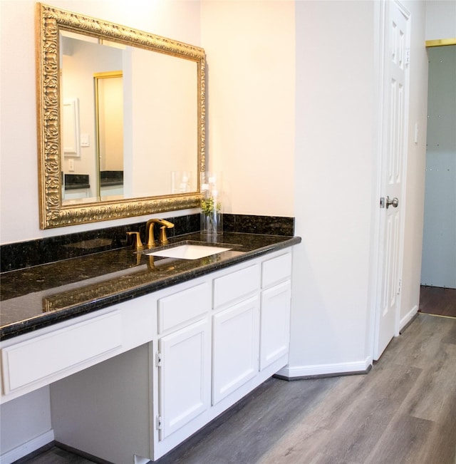 3222 Serene Oak Dr, Sugar Land, TX 77478 - bathroom with wood finished floors, baseboards, and vanity